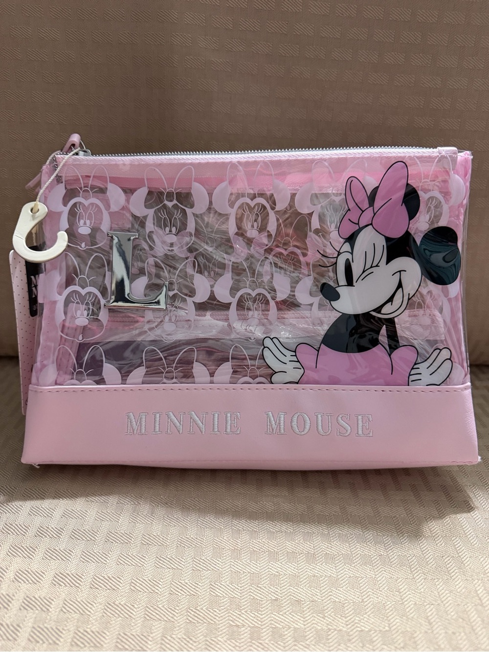 Minnie Mouse Pink Clear Cosmetic Bag “L” monogram on front.